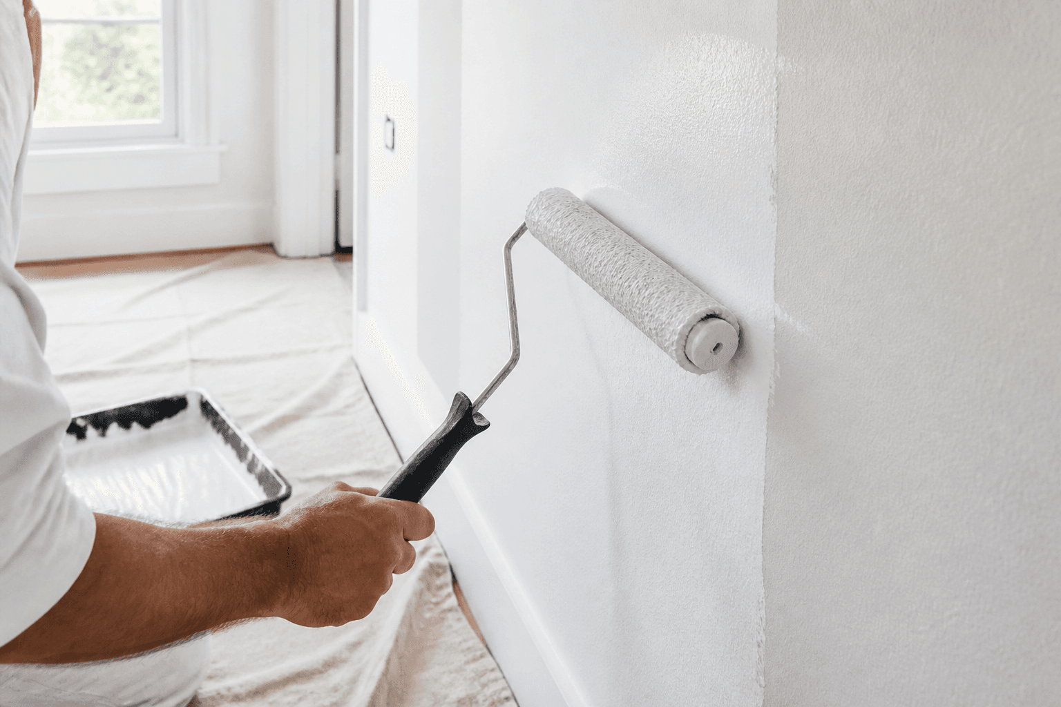 Professional interior wall painting with a roller